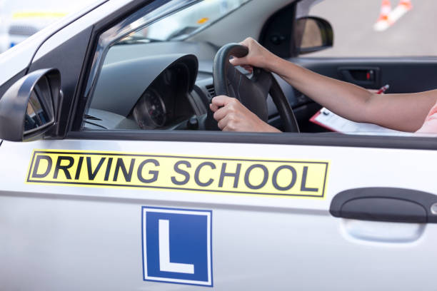 istock Learning to drive a car. Driving school. 828674318