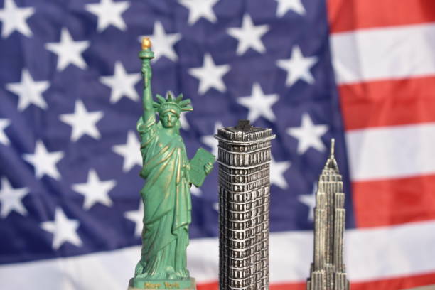 istock Statue of Liberty, Flatiron Building, Empire State Building with US Flag 828674570