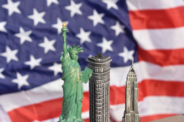 istock Statue of Liberty, Flatiron Building, Empire State Building with US Flag 828674574