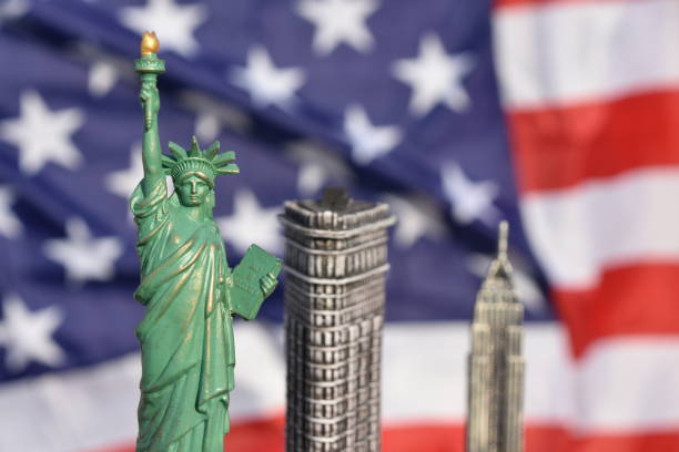 istock Statue of Liberty, Flatiron Building, Empire State Building with US Flag 828675628