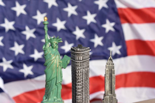 istock Statue of Liberty, Flatiron Building, Empire State Building with US Flag 828675644