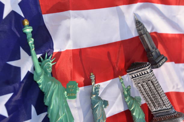 istock Statue of Liberty, Flatiron Building, Empire State Building with US Flag 828675652