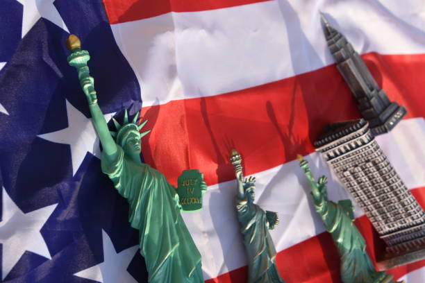 istock Statue of Liberty, Flatiron Building, Empire State Building with US Flag 828676556