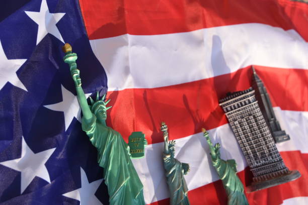 istock Statue of Liberty, Flatiron Building, Empire State Building with US Flag 828677062