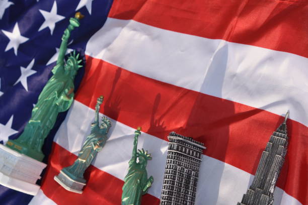 istock Statue of Liberty, Flatiron Building, Empire State Building with US Flag 828681714