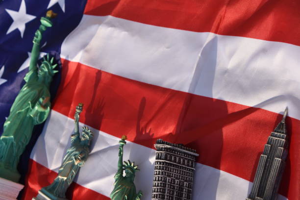 istock Statue of Liberty, Flatiron Building, Empire State Building with US Flag 828681786