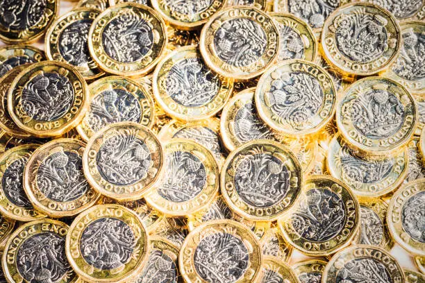 Photo of Pile of new UK One Pound Coins