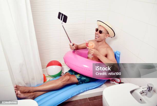 Man With Swim Ring Taking Selfie In The Bathroom Stock Photo - Download Image Now - Humor, Staycation, Vacations