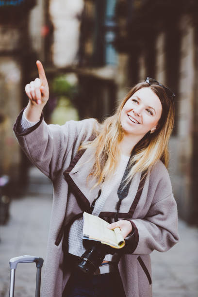istock Woman having pamphlet and looking for her route 828695380
