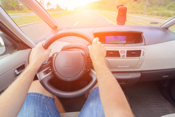 istock Driving a car - first person view 828697840