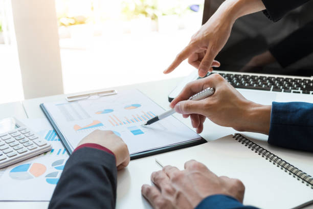 istock Business team meeting working with new startup project, discussion and analysis data the charts and graphs. Digital tablet calculator, laptop computer using, Business finances and accounting concept 828719280