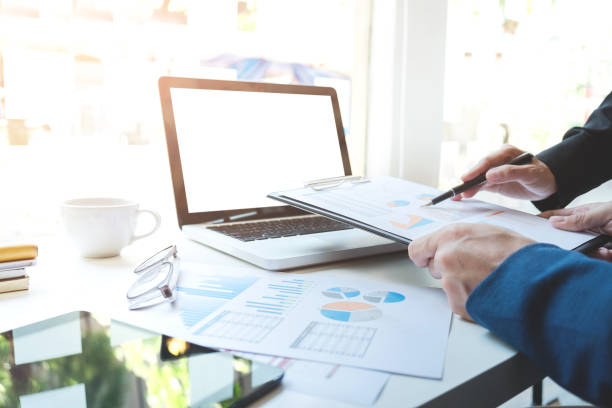 istock Young businessteam working with new startup project. discussing the charts and graphs showing the results at meeting. Business accounting and financial concept 828719314