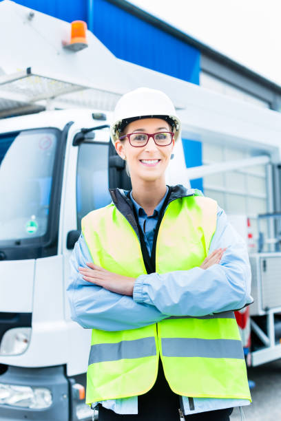 istock Female engineer in front of truck on site 828736578
