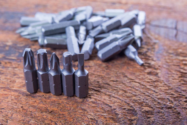 istock Metal screw driver heads, bit on the wood. Use for drill machine. 828741166