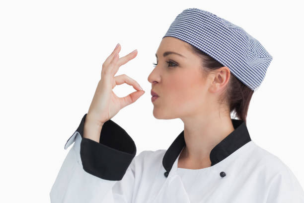 istock Chef making sign for tasty with her hands 828741692