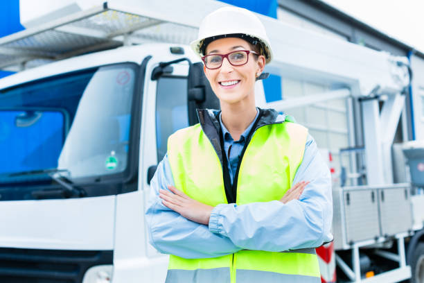 istock Female engineer in front of truck on site 828754158