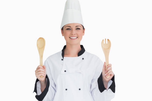 istock Cook holding wooden salad tosses 828767652