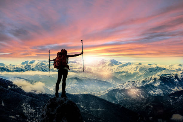 Female Hiker Silhouette at mountain peak