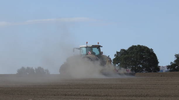 istock Plowing of the ground with tractor 828796660