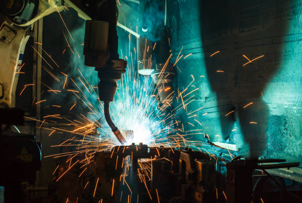 istock Welding robots machine in a car factory, manufacturing, industry 828810920