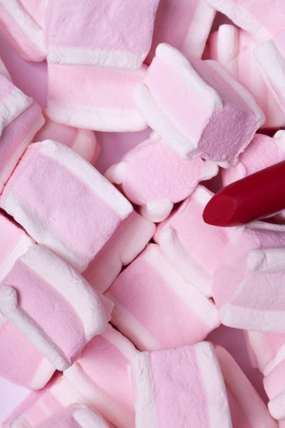 istock Red lipstick on a background of sweets 828811082
