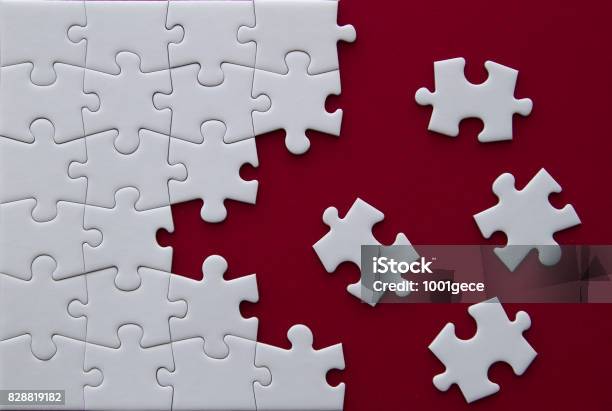 Puzzle Pieces On Red Background Stock Photo - Download Image Now - Jigsaw Puzzle, Togetherness, Empty