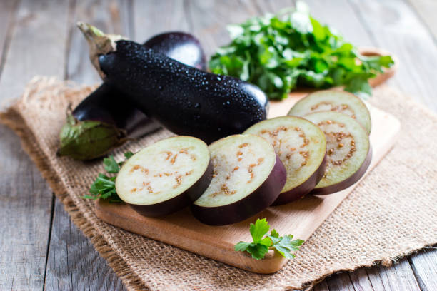 istock Sliced eggplant on wooden cutting board 828825752