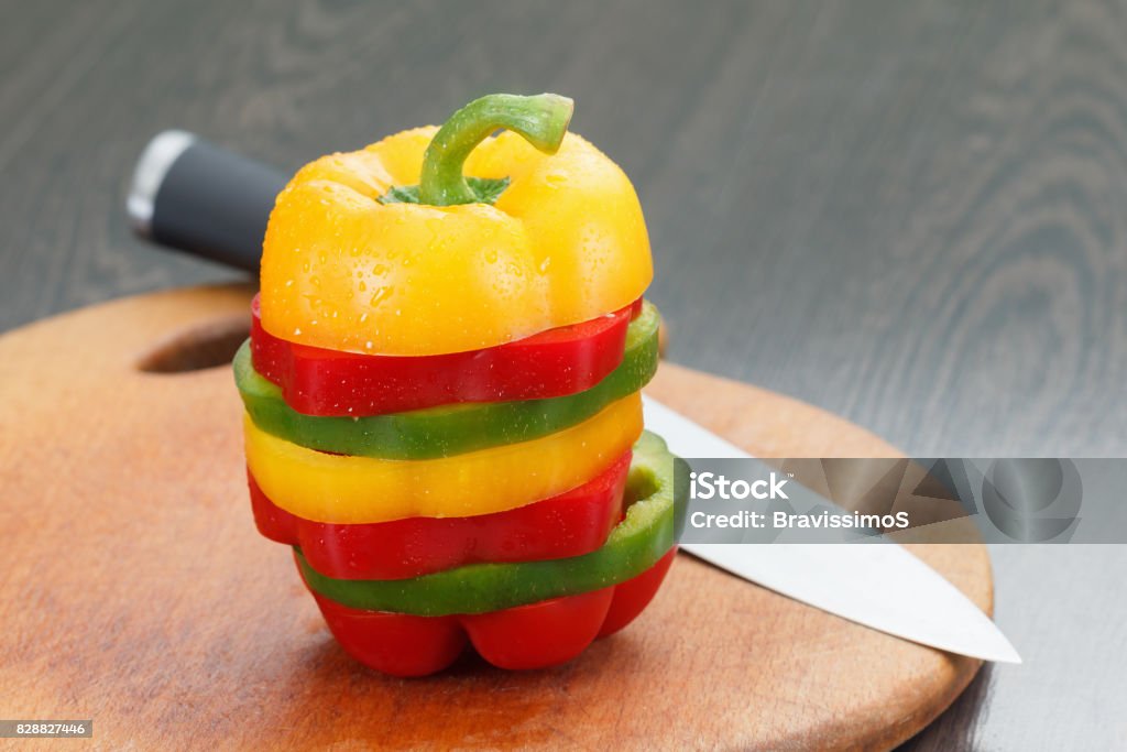 Sliced bell peppers. Dieting vegetable concept. Fresh sliced vegetable bell peppers on wooden cutting board Bell Pepper Stock Photo