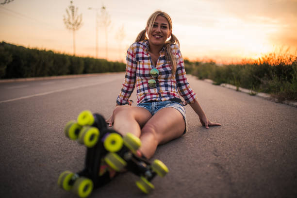istock Blonde woman with rollers sitting on the road 828847612
