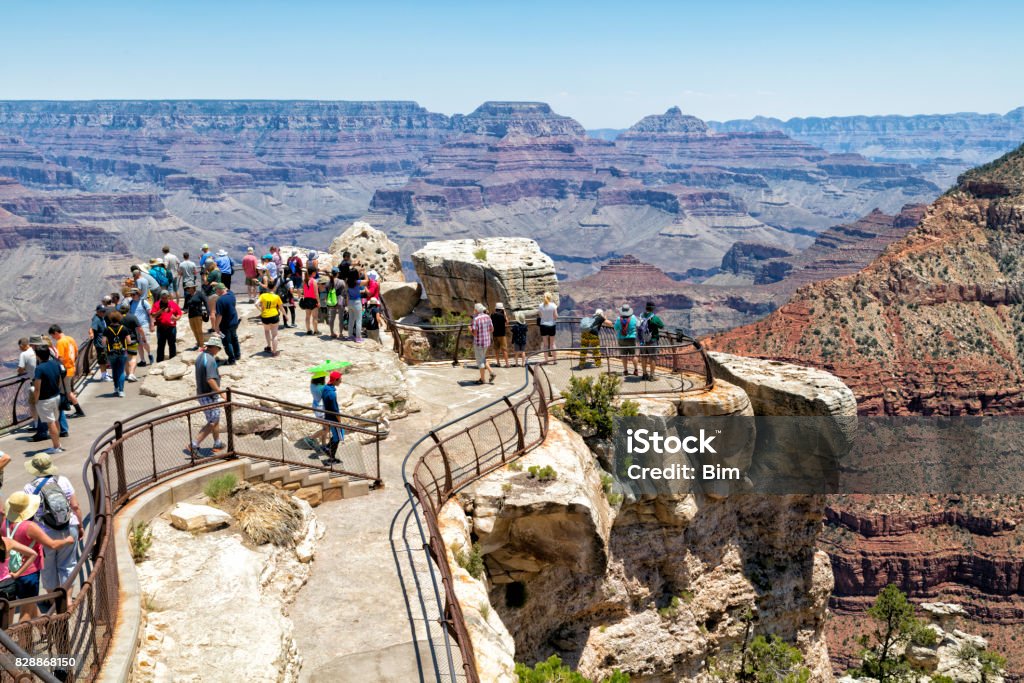 Visitors Enjoying Views of Grand Canyon National Park, Arizona, USA Tourists at viewpoint, South Rim, Grand Canyon National Park, Arizona, USA Grand Canyon National Park Stock Photo