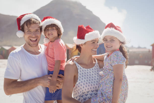 istock Smiling family wearing Santa hat 828869886