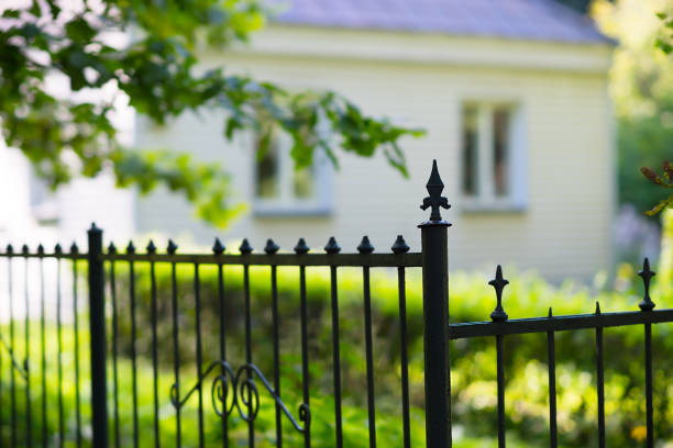 istock City park fence view on bokeh house backdrop 828871486
