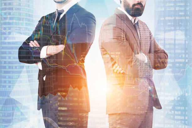 istock Two businessmen, city and graphs 828907516