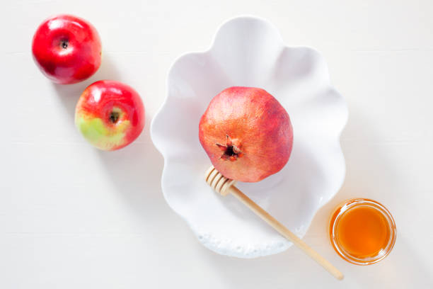 istock Apples, pomegranate and honey for Rosh Hashanah 828915002