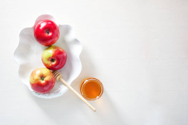 istock Apples, pomegranate and honey for Rosh Hashanah 828916264