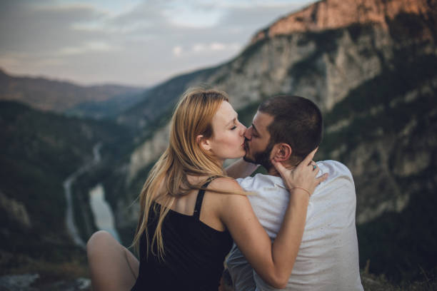 istock Young couple kissing 828928082