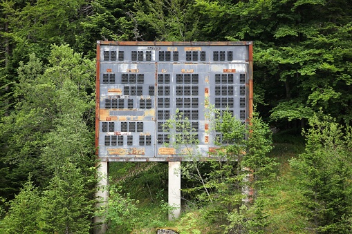 Saint-Nizier du Moucherotte, France - June 25 2017: Abandoned winter olympic site at the ski jumping large hill in Saint-Nizier du Moucherotte, France. The site has been built for the winter olympic games in 1968 in Grenoble