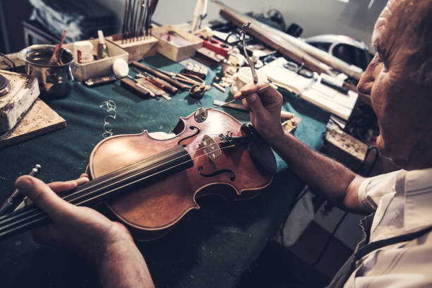 istock Senior entrepreneur working in instrument shop 828933638
