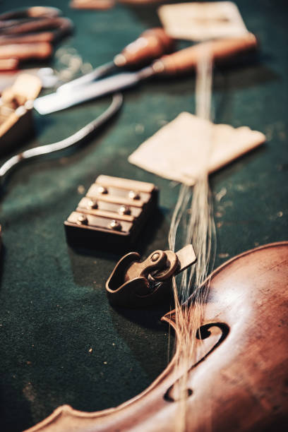 istock Senior entrepreneur repairing violins 828933640
