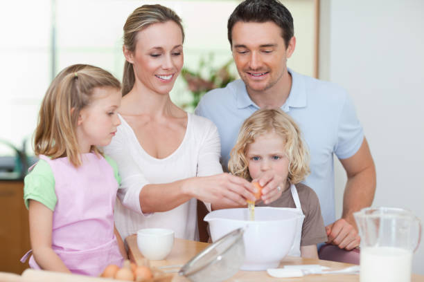 istock Family preparing dough together 828935796