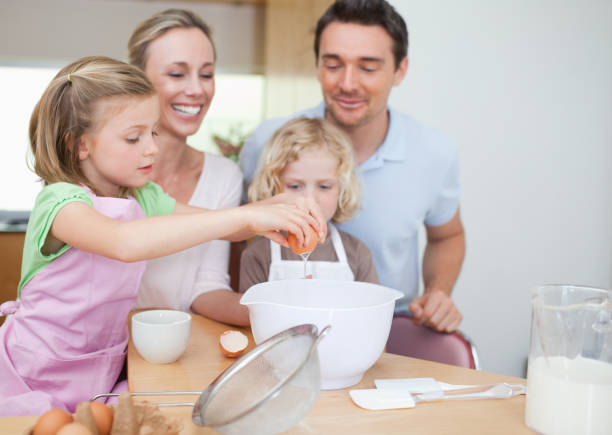 istock Happy family preparing dough together 828935902