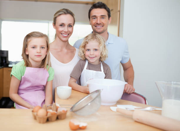 istock Happy family preparing cookies 828938612