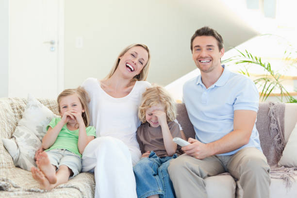 istock Family laughing on the sofa 828945648