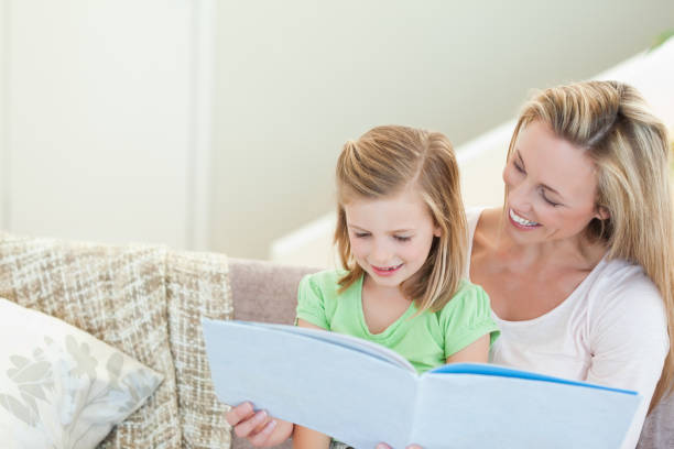 istock Mother and daughter reading a magazine 828952834