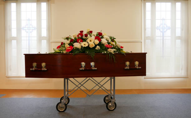 a colorful casket in a hearse or chapel before funeral or burial at cemetery closeup shot of a colorful casket in a hearse or chapel before funeral or burial at cemetery coffin stock pictures, royalty-free photos & images