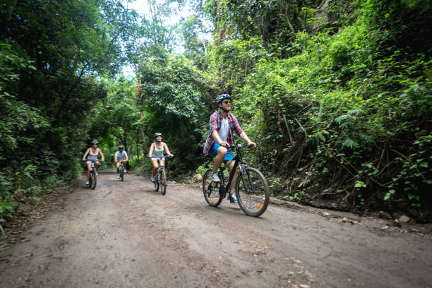 Group of people biking outdoors and looking very happy