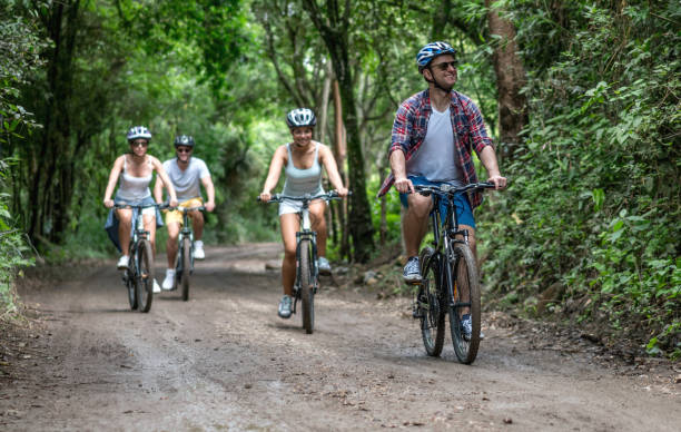 istock Group of friends cycling outdoors and having fun 828991596