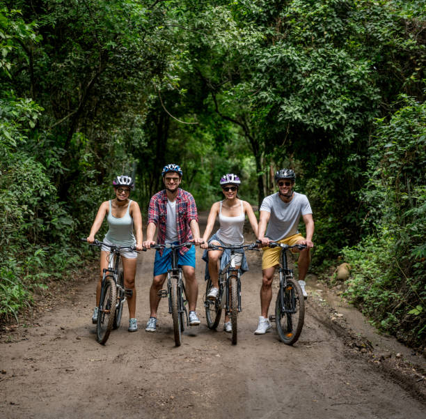 istock Group of people looking happy mountain biking 828991662