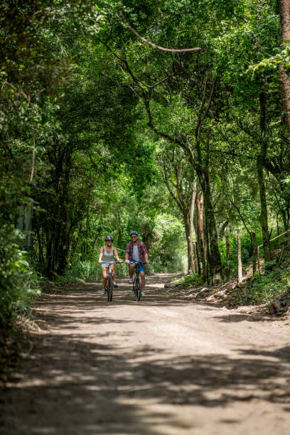 istock Happy couple mountain biking 828991726