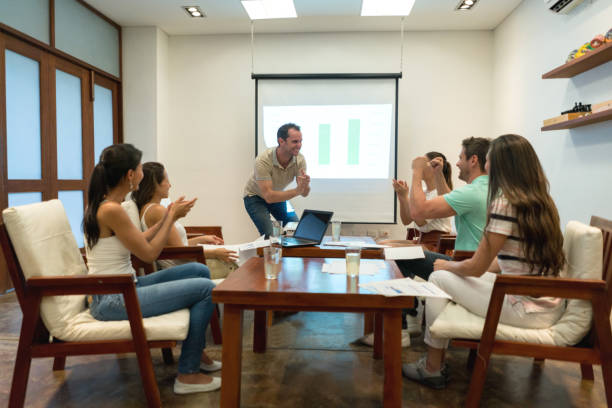istock Successful man making a business presentation at the office 828991754